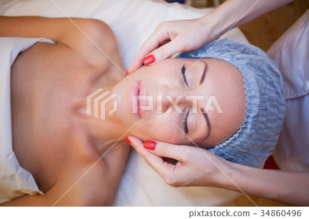 doctor cosmetologist doing facial massage girl spa doctor cosmetologist doing facial massage girl spa 34860496