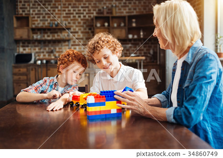 Smart joyful children spending free time with Smart joyful children spending free time with 34860749