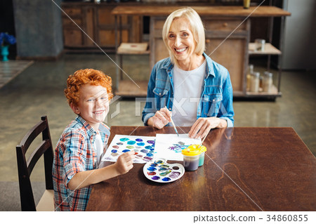 Excited family members grinning broadly into Excited family members grinning broadly into 34860855