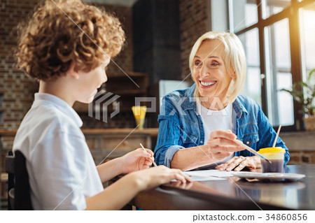 Beautiful elderly lady smiling while talking with 34860856