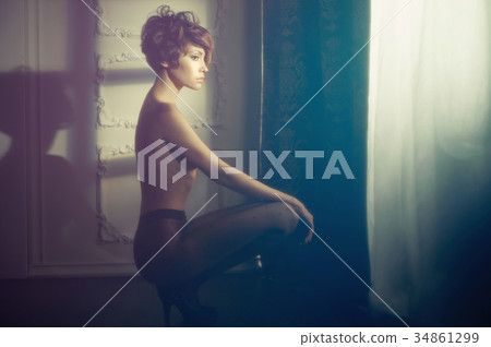 Sensual lady in classical interior 34861299