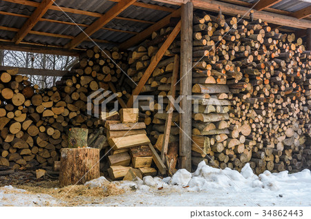 woodshed full of chopped firewood in winter 34862443