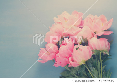 Fresh peonies on blue 34862639