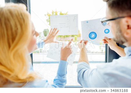 Two office workers learning diagram 34863188
