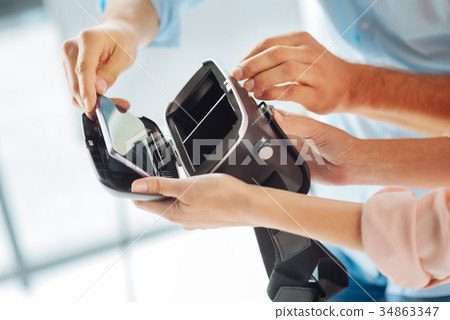 Close up of female hands that holding box Close up of female hands that holding box 34863347