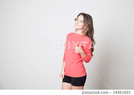 beautiful girl shows symbols of fingers and the beautiful girl shows symbols of fingers and the 34863801