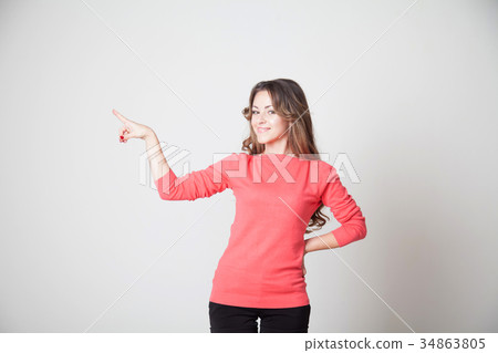 beautiful girl shows symbols of fingers and the beautiful girl shows symbols of fingers and the 34863805