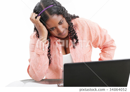 Young black female professional with hand in hair 34864052
