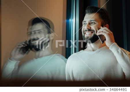 Happy brunette having friendly conversation 34864491