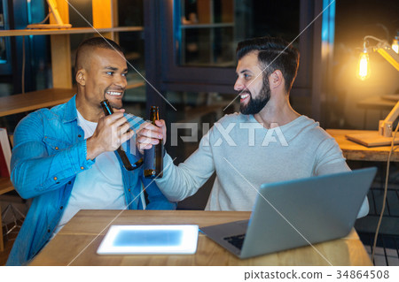 Handsome bearded man going to drink beer 34864508
