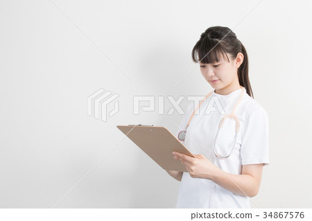 A woman in a white coat 34867576