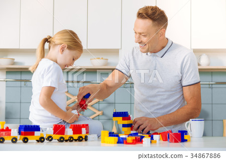 Delighted positive man having fun with his 34867886