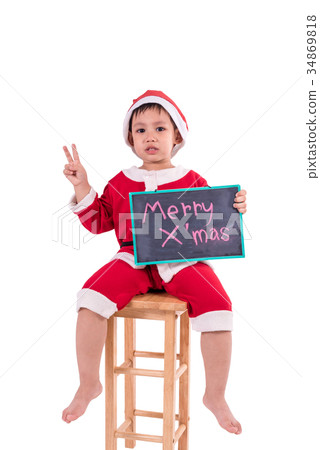 Asian kid dress up as santa claus. In his hand holding the black board . Asian kid dress up as santa claus. In his hand holding the black board . 34869818
