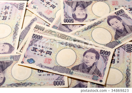 10000 yen bill and 5000 yen bill on 5000 yen background 10000 yen bill and 5000 yen bill on 5000 yen background 34869823