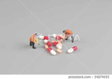 the worker of figure in front of pills the worker of figure in front of pills 34874035
