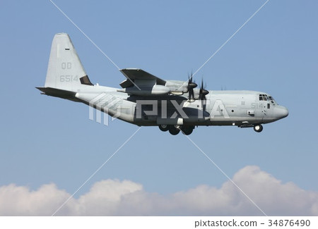 U.S. Marine Corps Airborne Killer flying a clear sky blue sky KC-130J Hercules 34876490