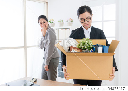 business girl holding personal belongings box 34877417