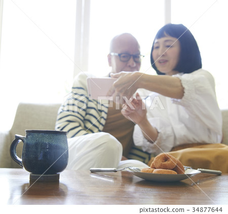 Senior couple coffee time smartphone photography Senior couple coffee time smartphone photography 34877644