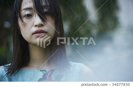 Woman struck by the rain 34877830