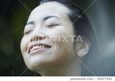 Woman struck by the rain 34877991