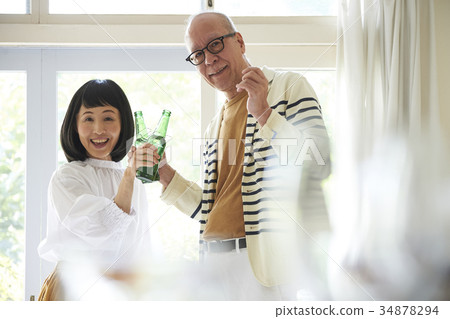 Senior couple toasting Senior couple toasting 34878294