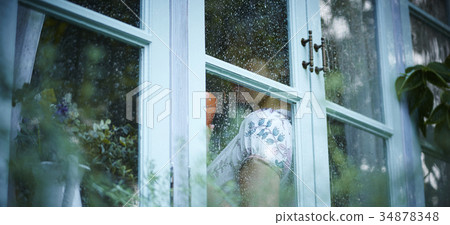 Rainy day woman spending at home 34878348