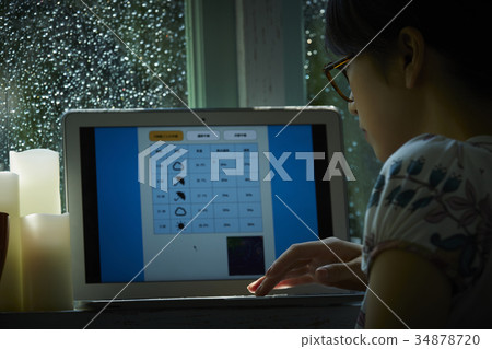 Rainy day woman searching for weather forecast 34878720