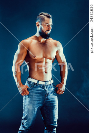 bodybuilder posing. Beautiful sporty guy male 34881636