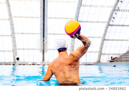 Water polo player in a swimming pool. 34881662