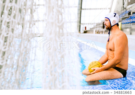 Water polo player in a swimming pool. 34881663