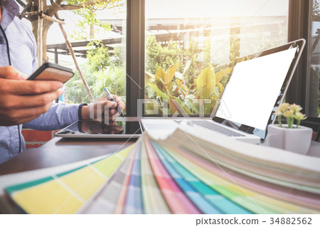 Creative creativity graphic designer working with graphics table 34882562