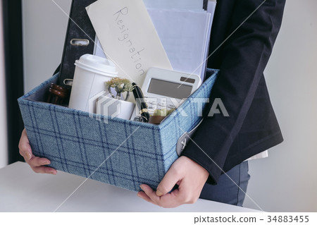 business woman carrying packing up all his personal belongings a 34883455