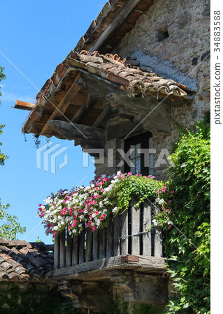 Old building with wooden balcony  34883588