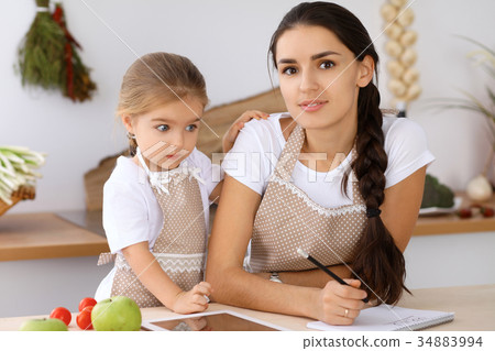 Happy family in the kitchen. Mother and child 34883994