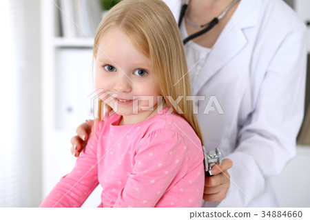 Pediatrician is taking care of baby in hospital Pediatrician is taking care of baby in hospital 34884660