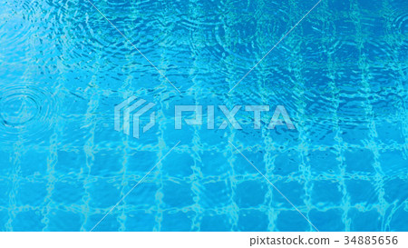 Rain drop falling on swiming pool. 34885656