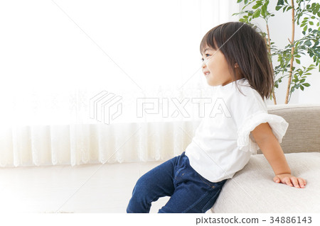 Child playing alone in the park 34886143