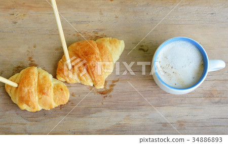 croissant stab chopstick walk to hot latte coffee croissant stab chopstick walk to hot latte coffee 34886893