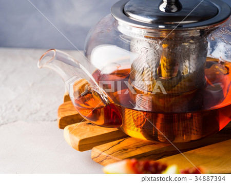 Teapot of red tea and honey Teapot of red tea and honey 34887394