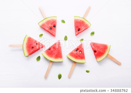 Watermelon slice popsicles on white background Watermelon slice popsicles on white background 34888762