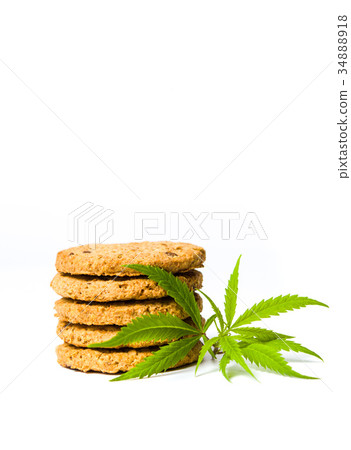 Integral cookies with marijuana leafs isolated 34888918