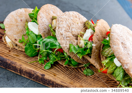 Pita sandwiches stuffed with chicken, vegetables 34889540