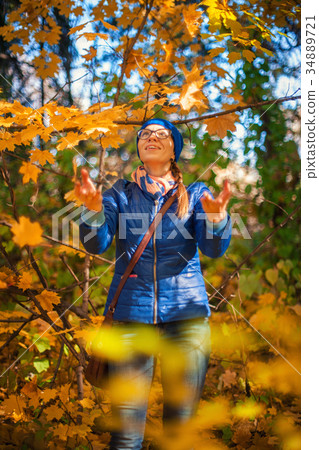 Beauty woman at autumn park Beauty woman at autumn park 34889721