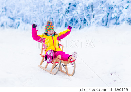 Kids play in snow. Winter sleigh ride for children 34890129