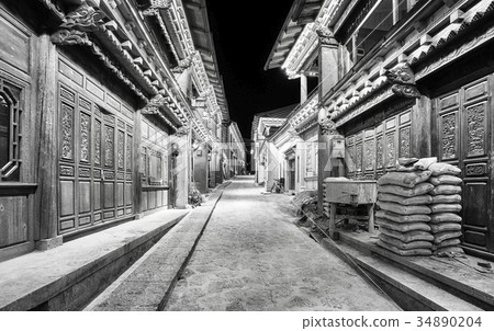 Illuminated empty street of Shangri La at night. 34890204
