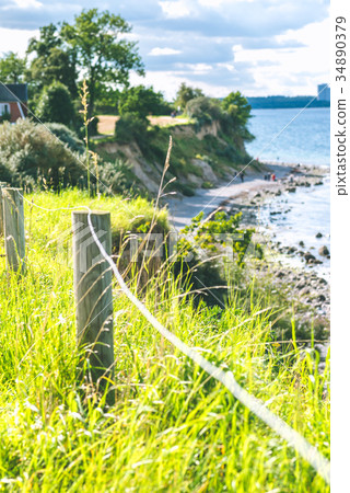 Baltic coastline. Escarpment slope lead to pebble 34890379