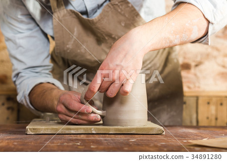 potter, stoneware, ceramics art concept - closeup 34891280