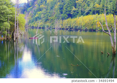 Canoe and natural lake 34891494