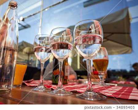 Row of pure drinking water glasses at summer 34893403