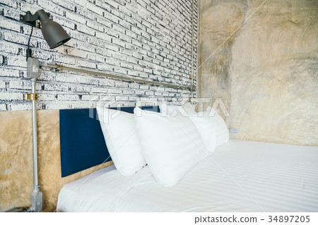 White pillow on bed White pillow on bed 34897205